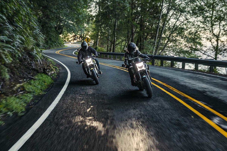 CFMOTO cyclists on seaside road