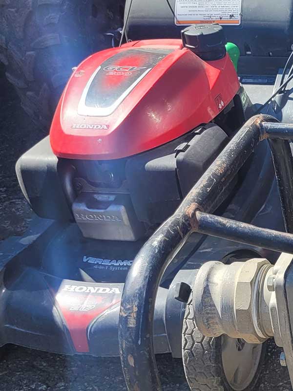 lawn mowers and engines in the yard
